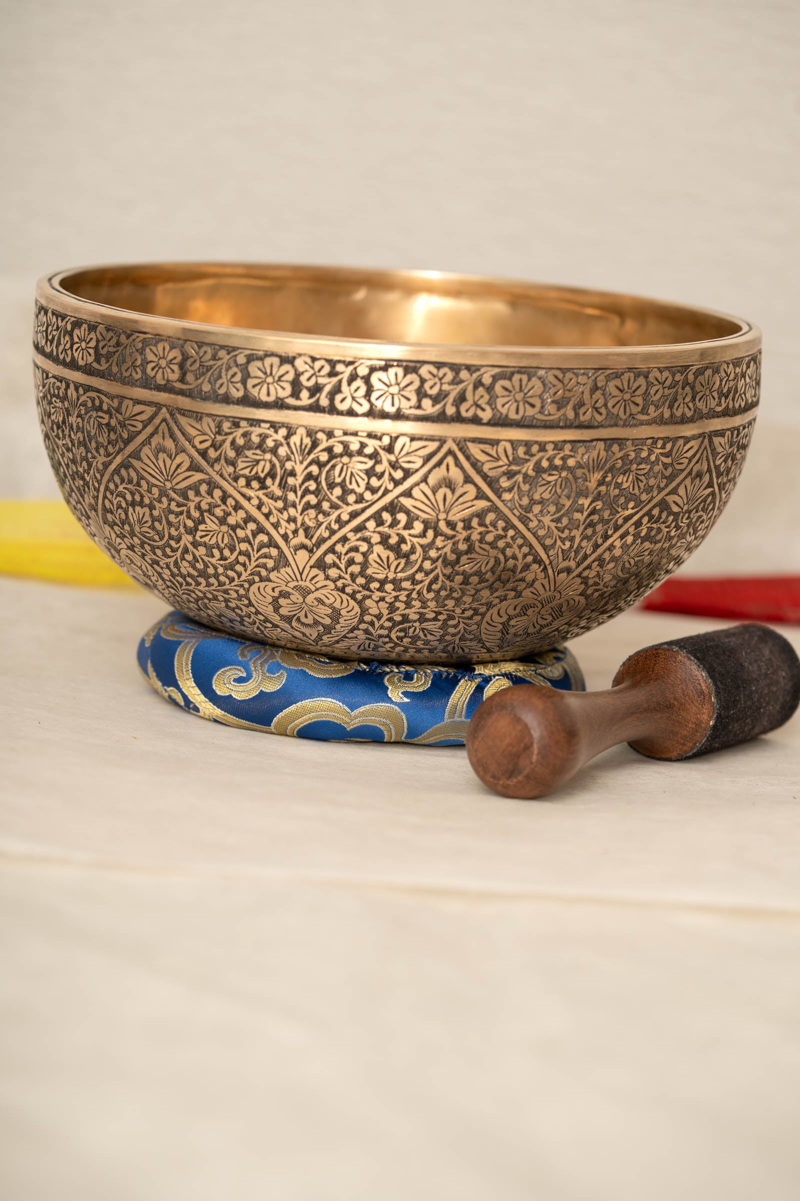 Lotus Floral Engraved handmade Tibetan singing bowl with brass carving, wooden mallet, and cushion for meditation and chakra healing
