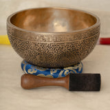 Handmade Himalayan floral engraved brass singing bowl tuned to B2 and C4 for chakra meditation and sound healing