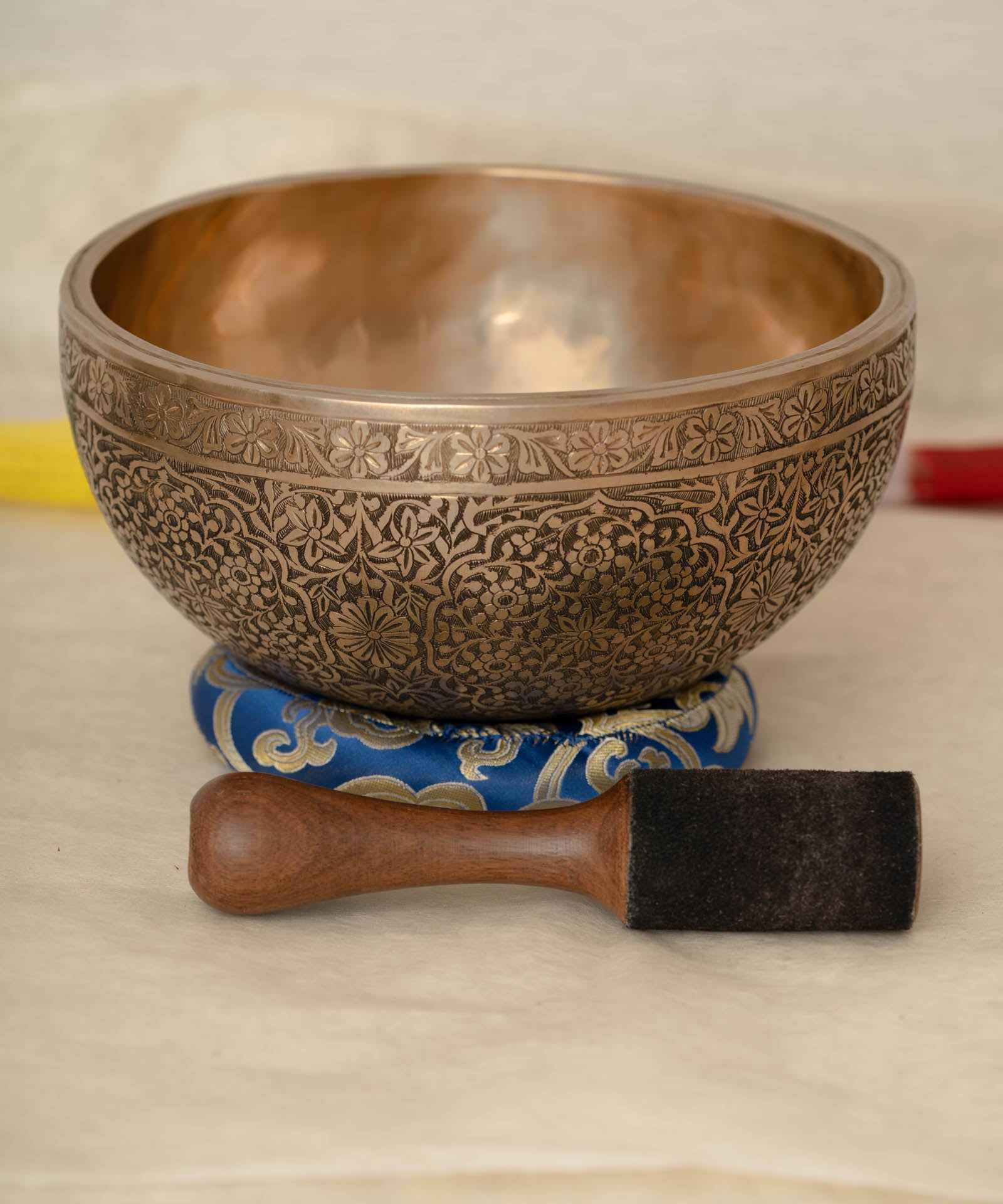 Handmade Himalayan floral engraved brass singing bowl tuned to B2 and C4 for chakra meditation and sound healing