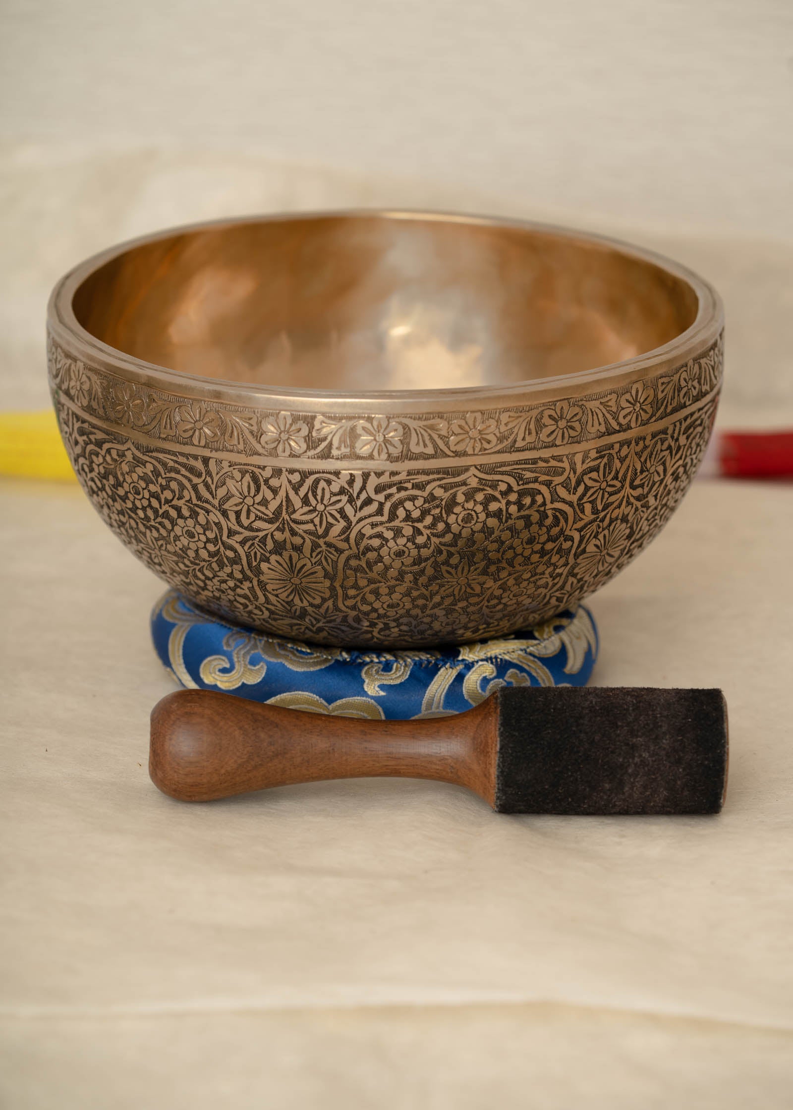 Handmade Himalayan floral engraved brass singing bowl tuned to B2 and C4 for chakra meditation and sound healing