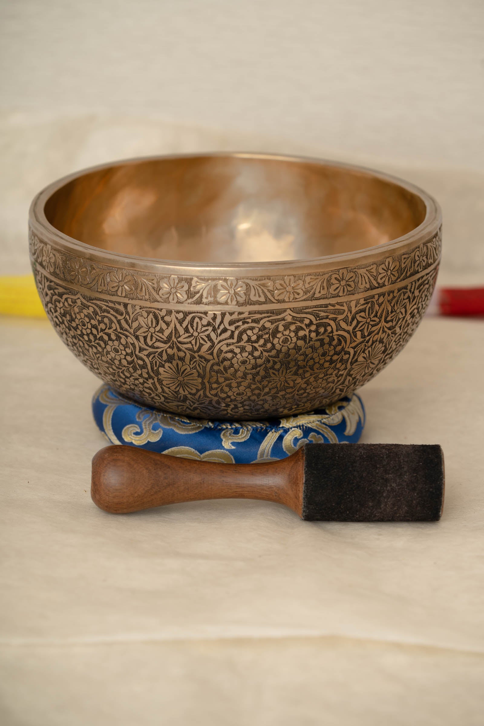 Handmade Himalayan floral engraved brass singing bowl tuned to B2 and C4 for chakra meditation and sound healing
