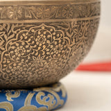 Handmade Himalayan floral engraved brass singing bowl tuned to B2 and C4 for chakra meditation and sound healing