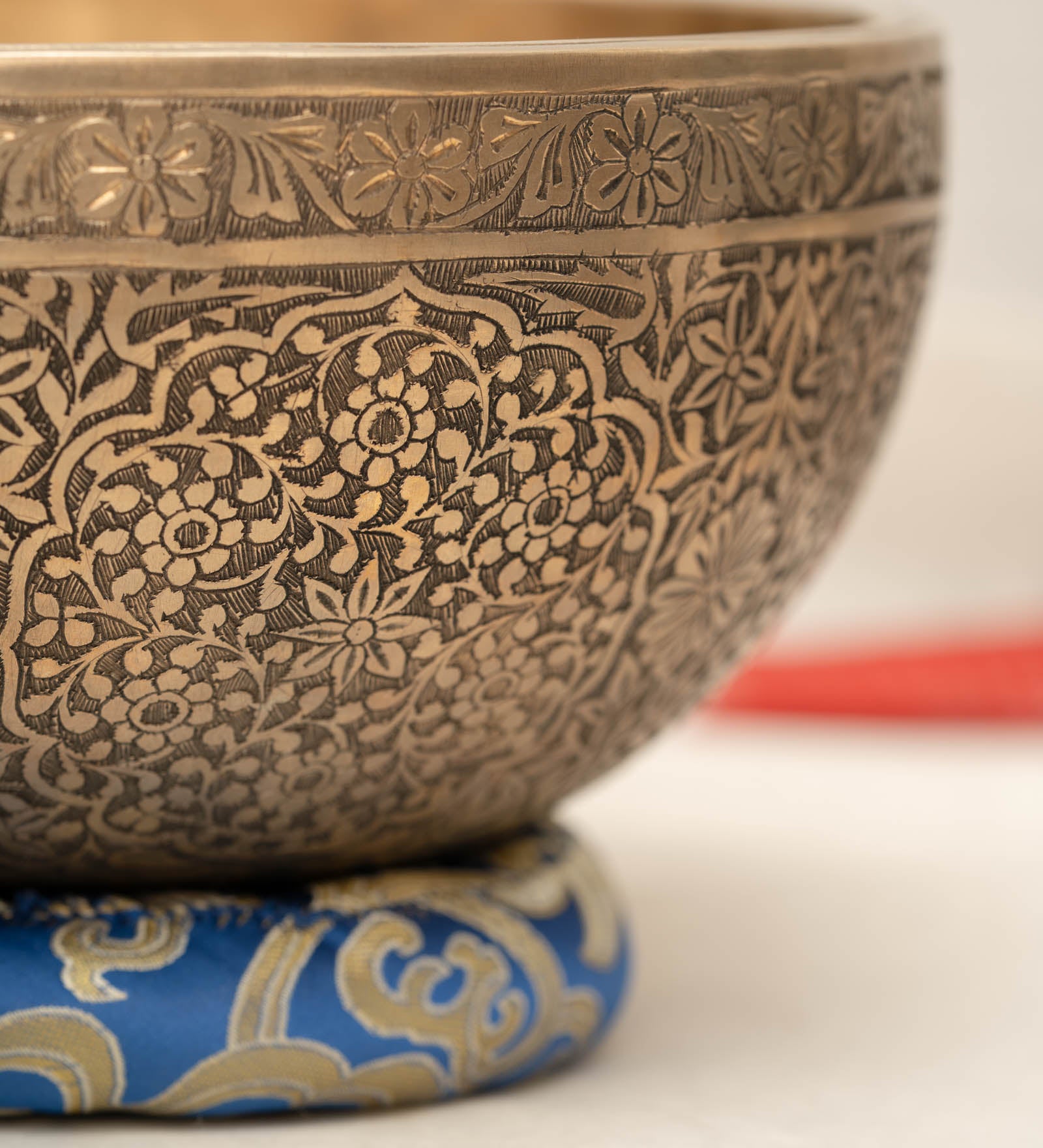 Handmade Himalayan floral engraved brass singing bowl tuned to B2 and C4 for chakra meditation and sound healing