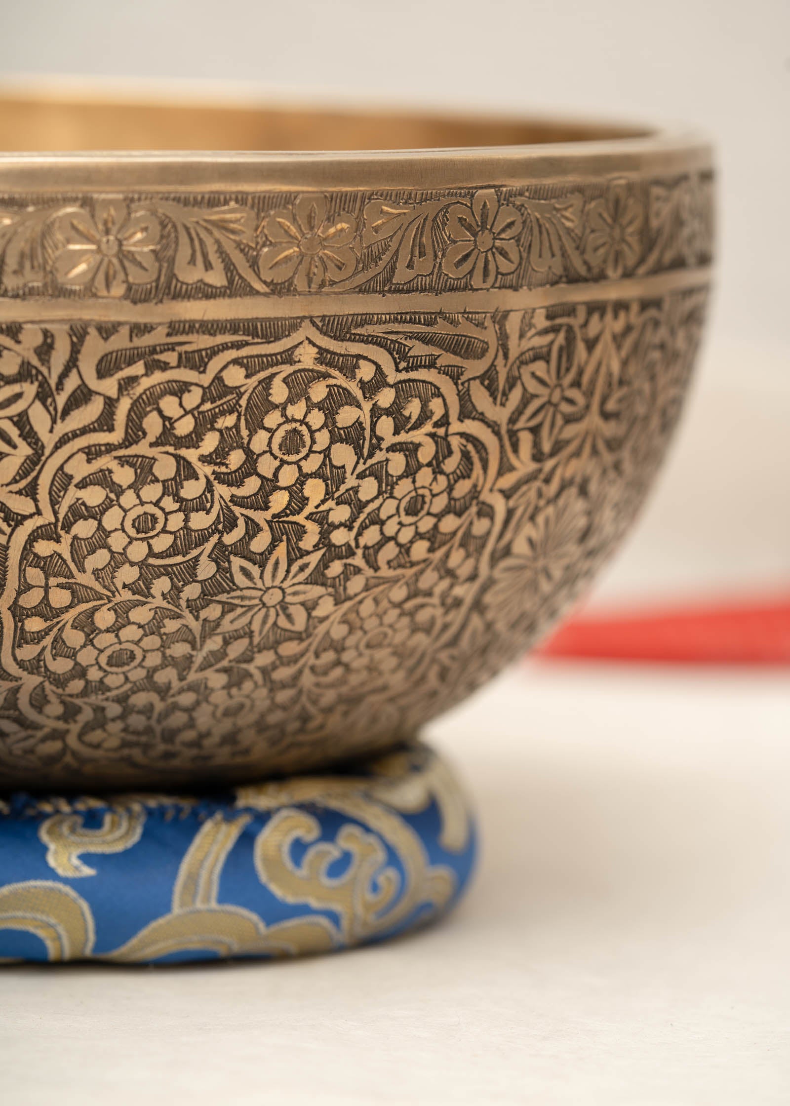 Handmade Himalayan floral engraved brass singing bowl tuned to B2 and C4 for chakra meditation and sound healing