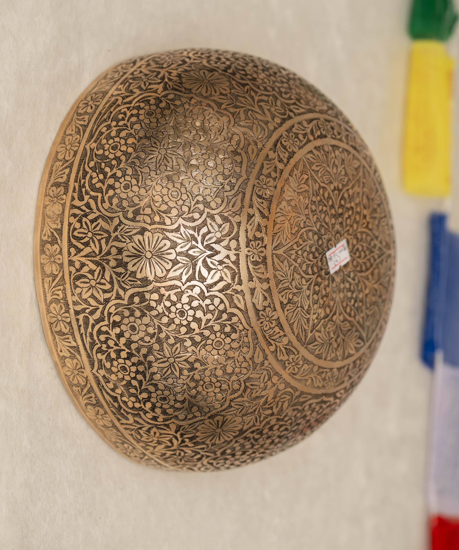 Handmade Himalayan floral engraved brass singing bowl tuned to B2 and C4 for chakra meditation and sound healing