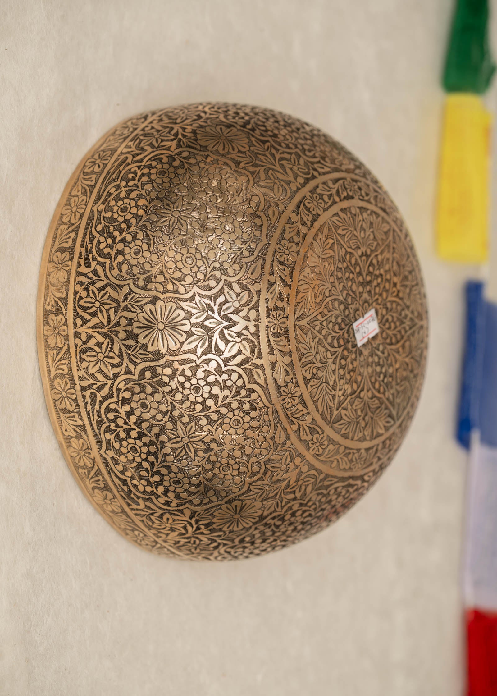 Handmade Himalayan floral engraved brass singing bowl tuned to B2 and C4 for chakra meditation and sound healing