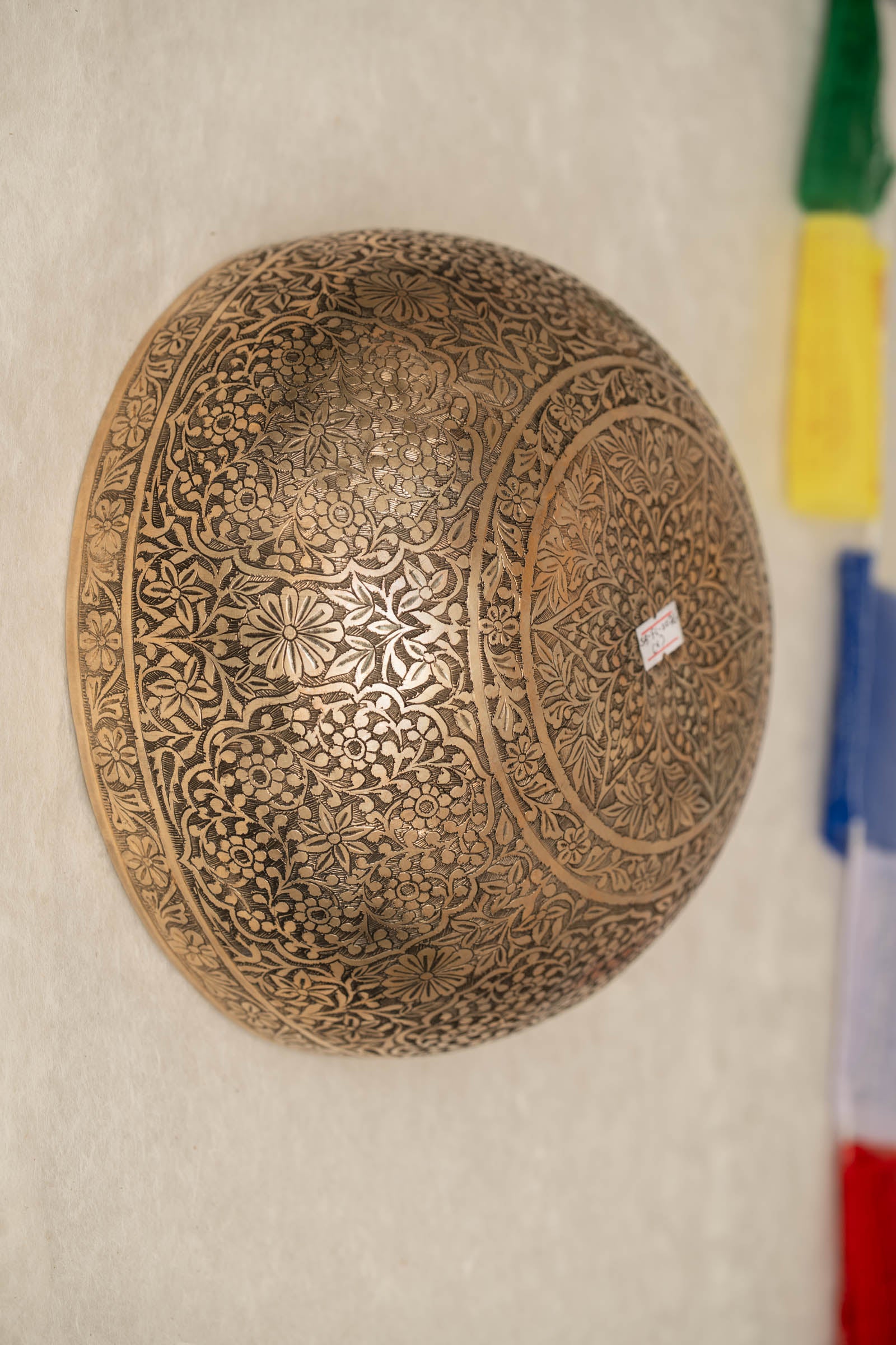Handmade Himalayan floral engraved brass singing bowl tuned to B2 and C4 for chakra meditation and sound healing