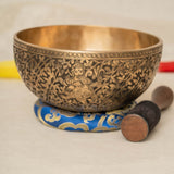 Handmade Himalayan Ganesha engraved brass singing bowl tuned to F3 and C5 for throat and heart chakra sound healing