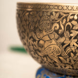 Handmade Himalayan Ganesha engraved brass singing bowl tuned to F3 and C5 for throat and heart chakra sound healing