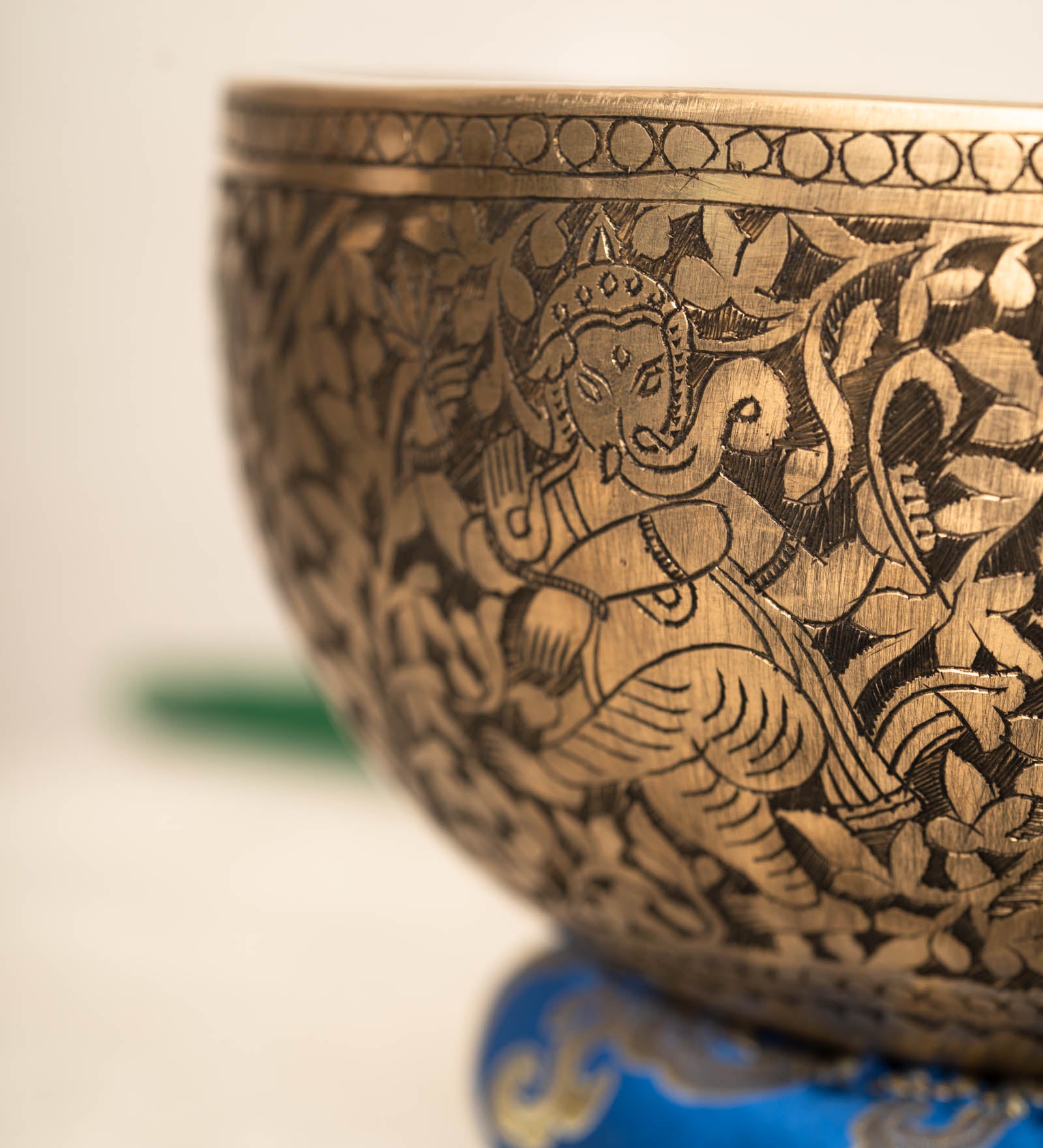 Handmade Himalayan Ganesha engraved brass singing bowl tuned to F3 and C5 for throat and heart chakra sound healing