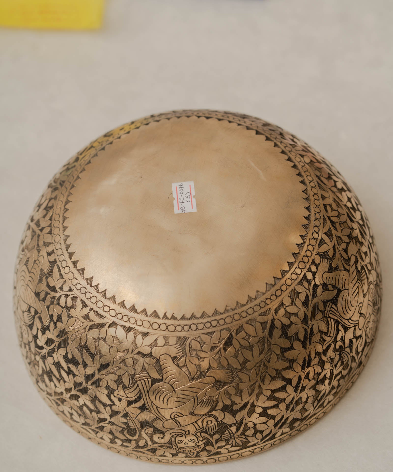 Handmade Himalayan Ganesha engraved brass singing bowl tuned to F3 and C5 for throat and heart chakra sound healing