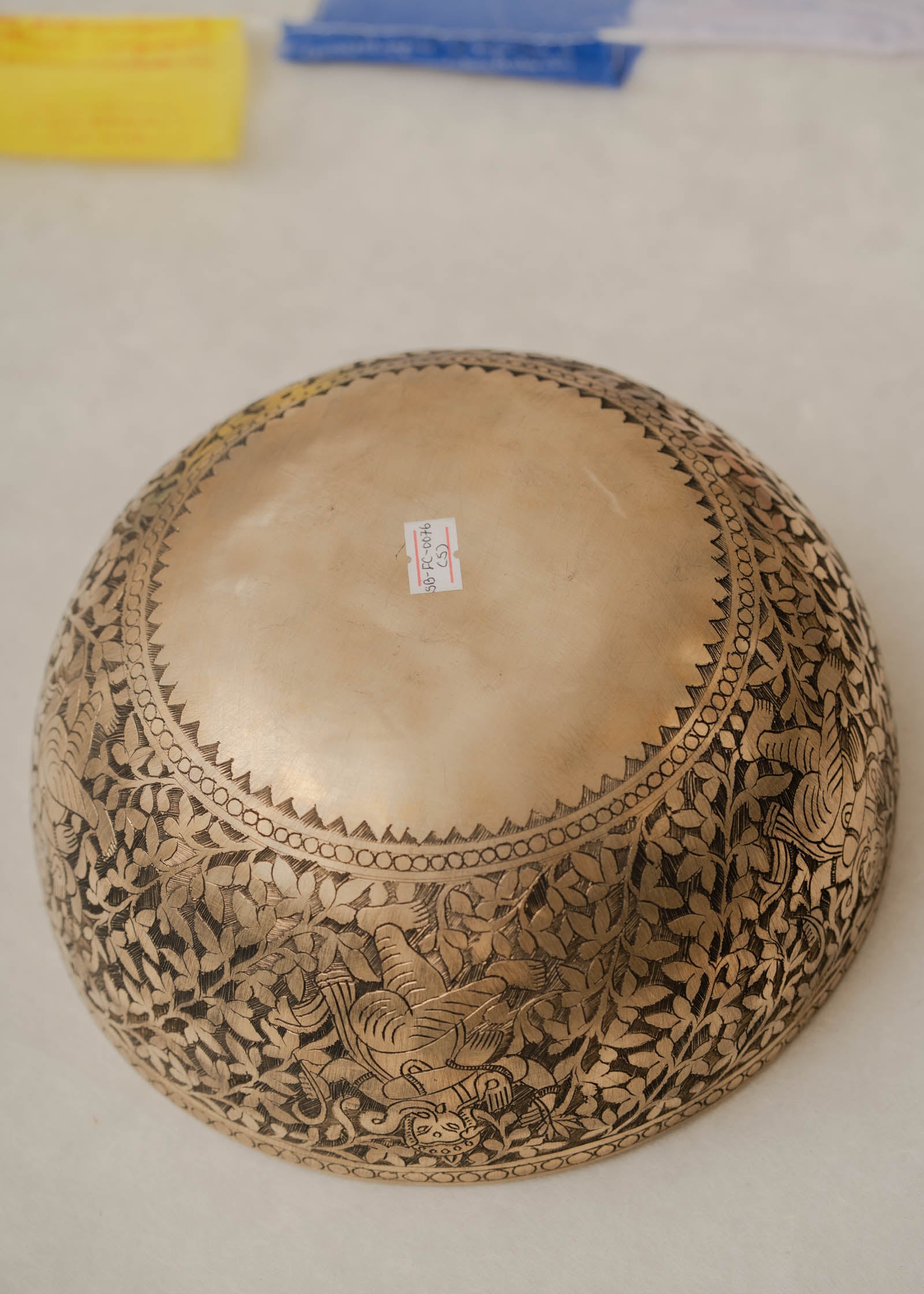 Handmade Himalayan Ganesha engraved brass singing bowl tuned to F3 and C5 for throat and heart chakra sound healing