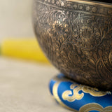 Handmade Himalayan traditional floral ornamental singing bowl carved design tuned to F3 and C5 for throat chakra sound healing