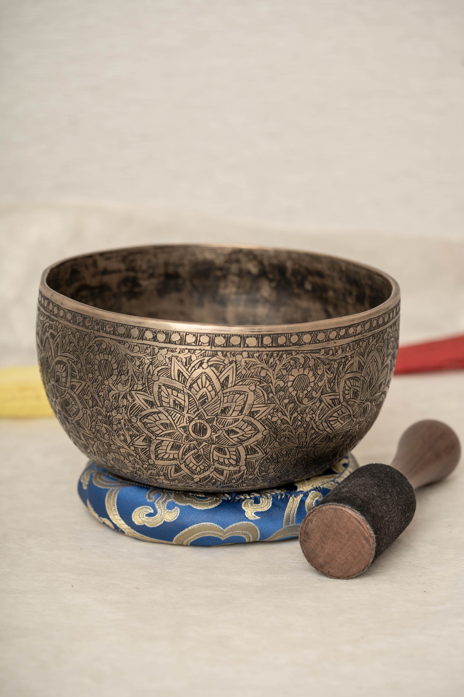 Handmade Himalayan lotus mandala engraved singing bowl tuned to F3 for meditation and sound healing
