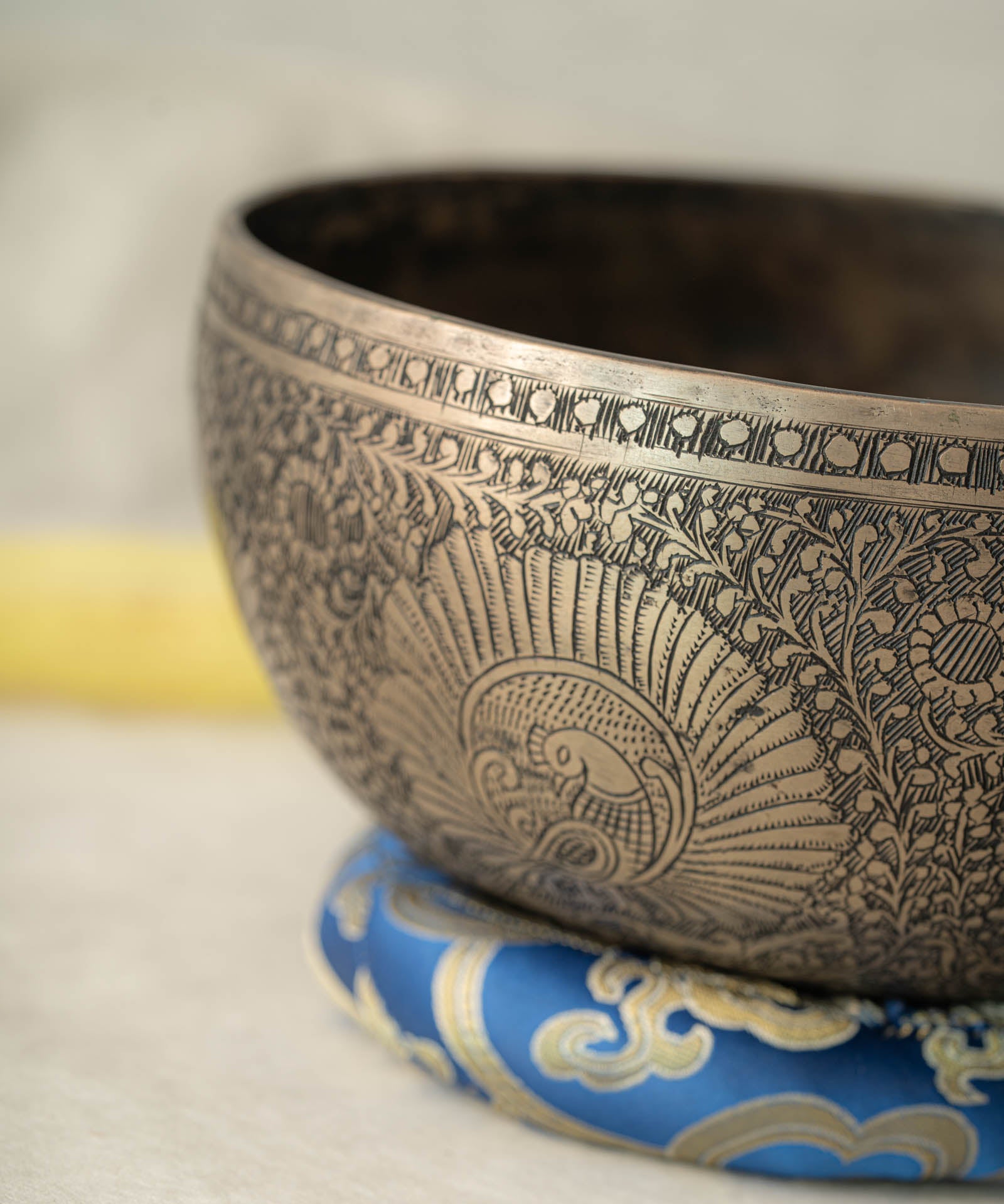 Handmade Himalayan peacock singing bowl carved design tuned to F3 for meditation and sound healing