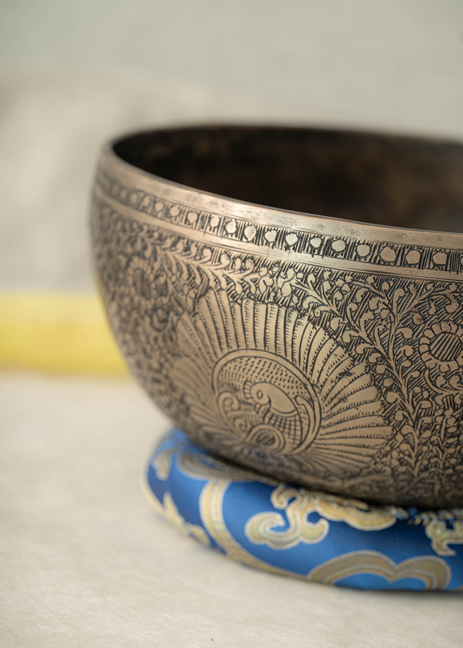 Handmade Himalayan peacock singing bowl carved design tuned to F3 for meditation and sound healing