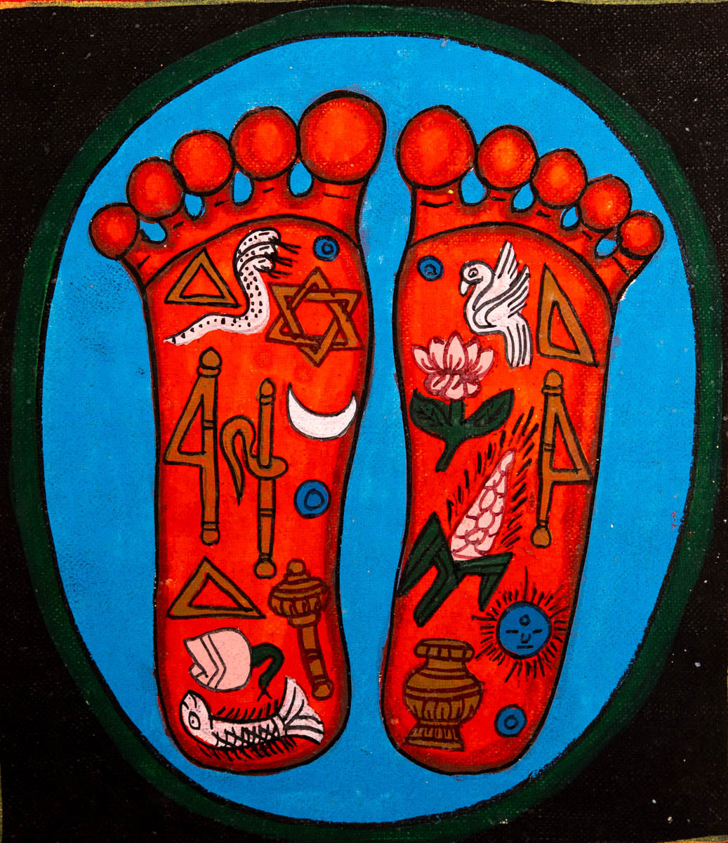 Painting of two sacred feet with colorful spiritual symbols