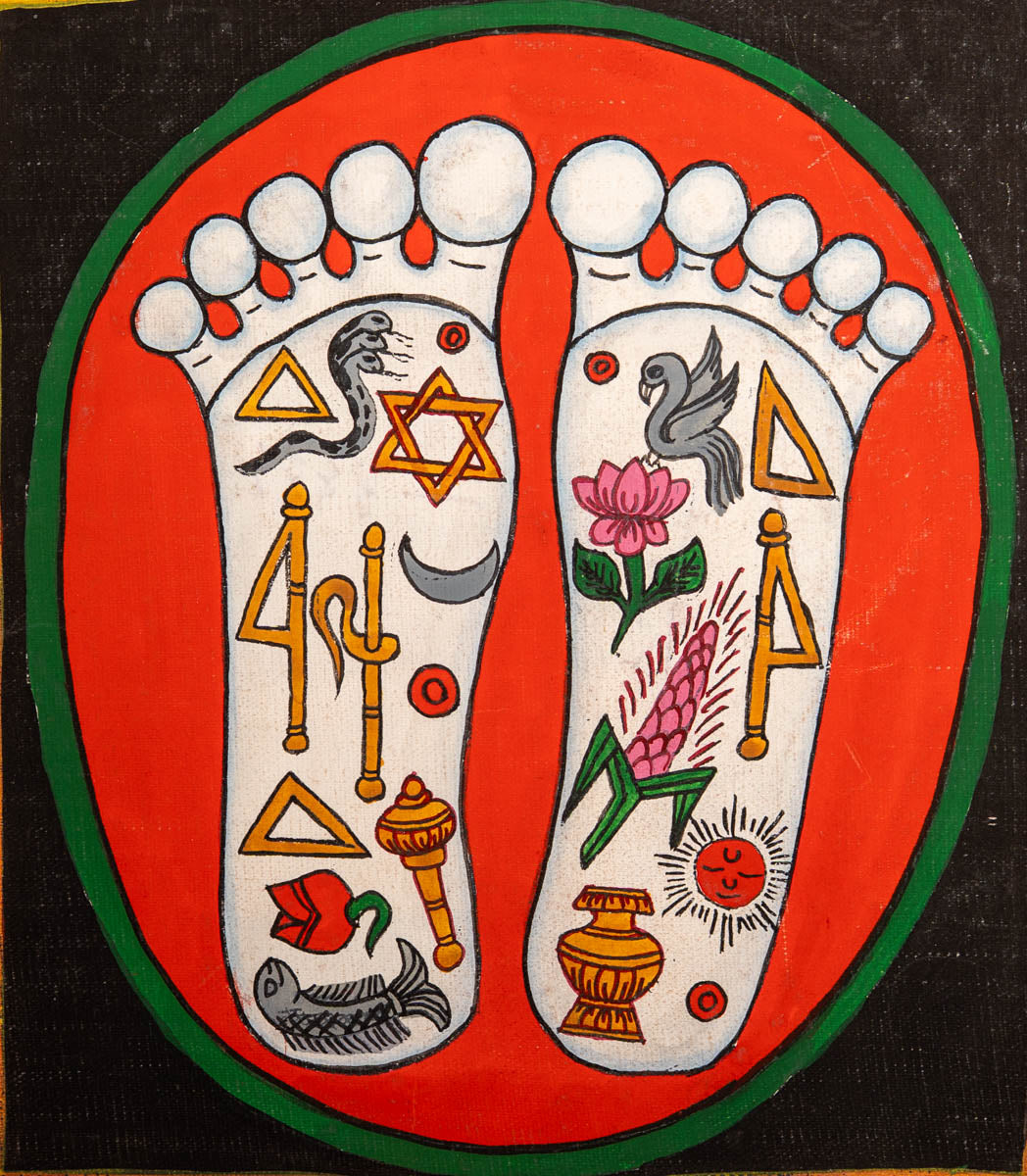 Painting of two sacred feet with colorful spiritual symbols