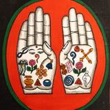 Painting of two open hands with sacred Buddhist symbols 