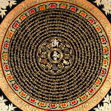 Handcrafted Tibetan mantra mandala thangka with gold script, floral corner motifs, and ornate circular design on a black background