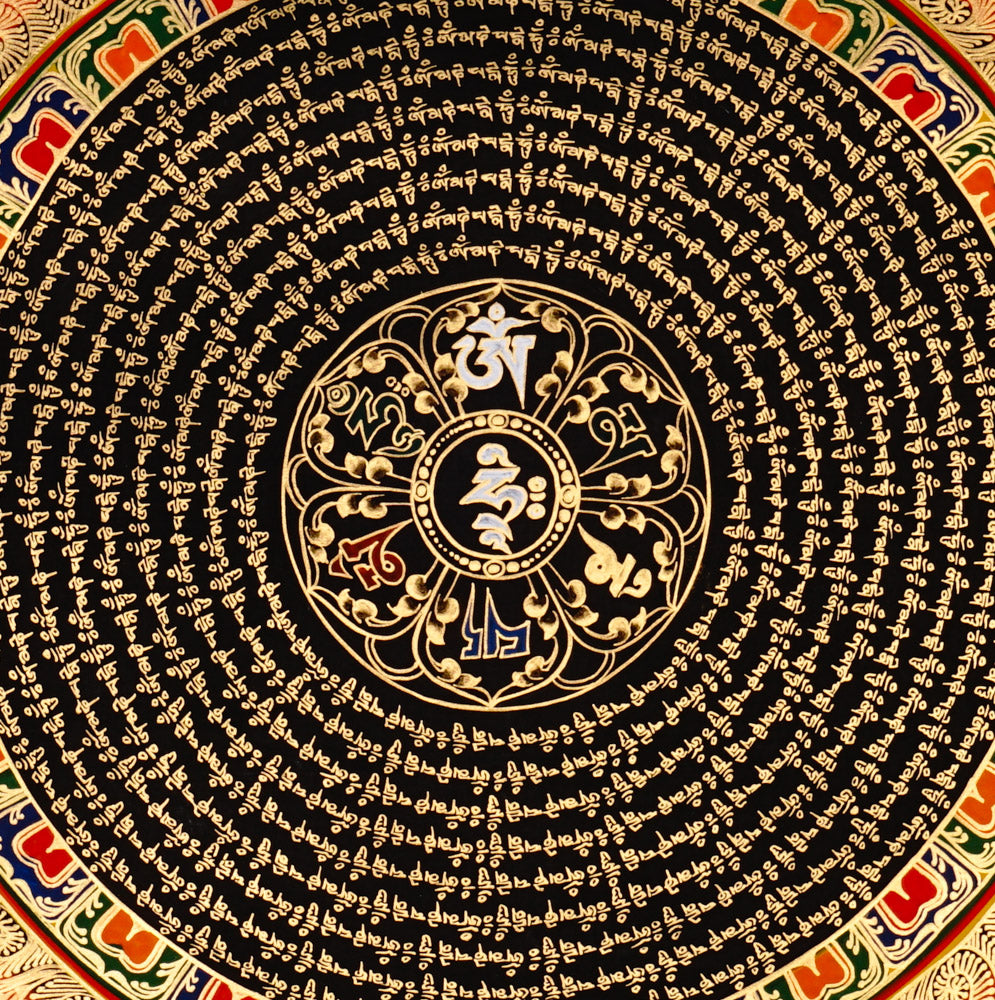 Handcrafted Tibetan mantra mandala thangka with gold script, floral corner motifs, and ornate circular design on a black background