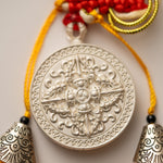 Tassel-Adorned Endless Knot Locket