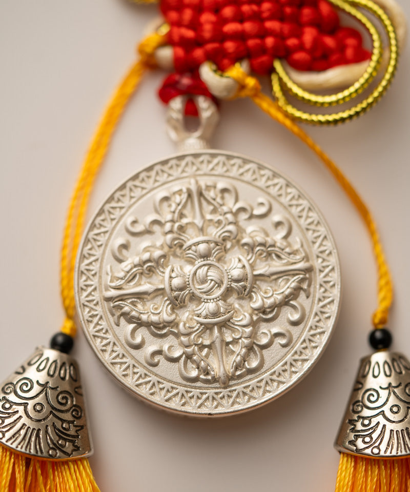 Tassel-Adorned Endless Knot Locket