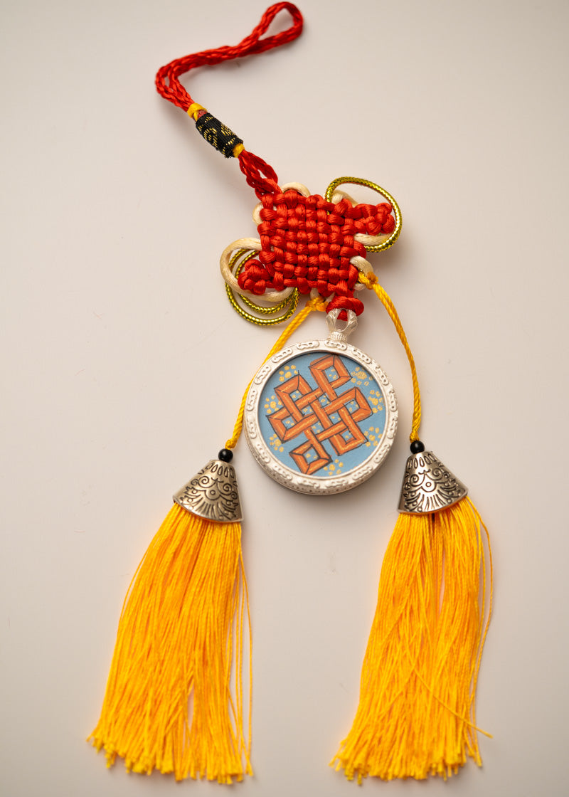 Tassel-Adorned Endless Knot Locket