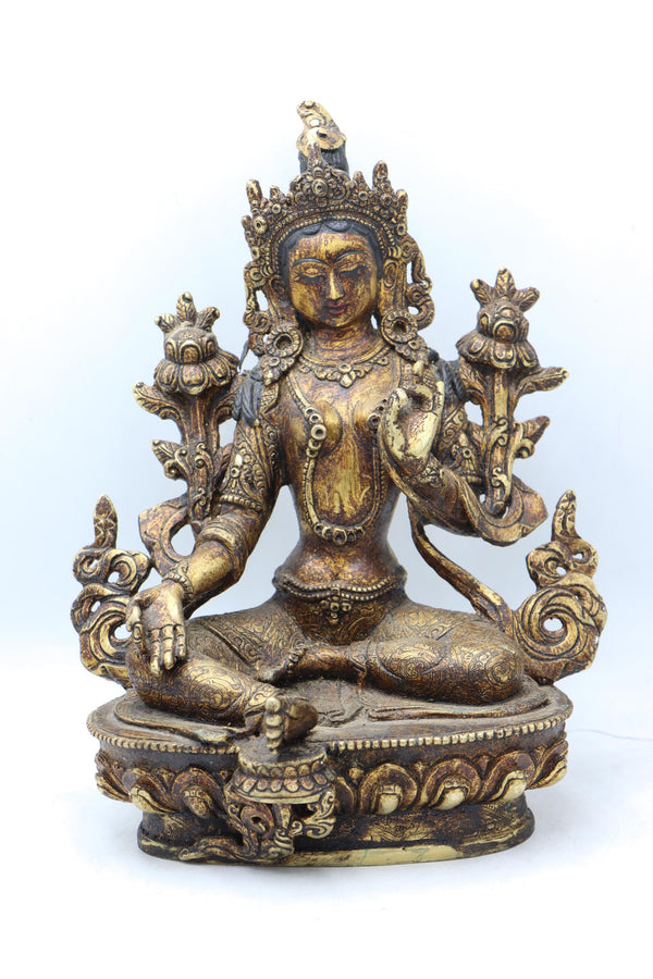 Green Tara statue for meditation and prayer .