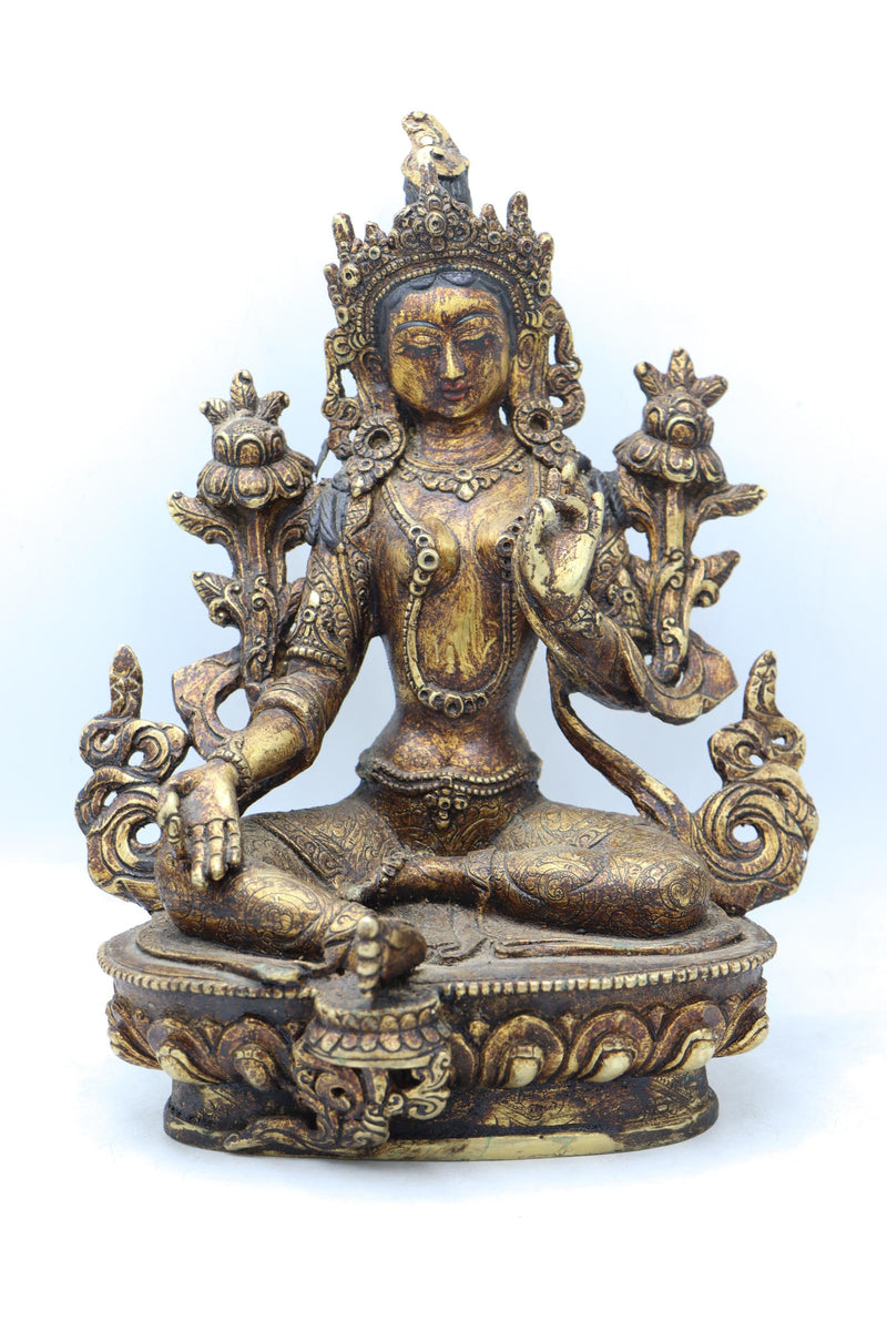 Green Tara statue for meditation and prayer .