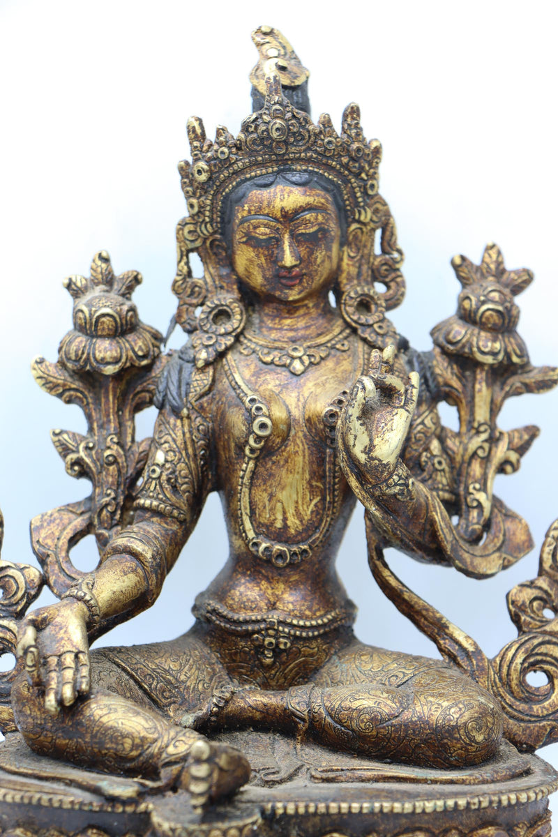 Green Tara statue for meditation and prayer .