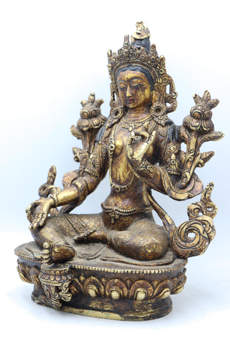 Green Tara statue for meditation and prayer .