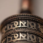 Wood handle prayer wheel for spiritual and religious routines.
