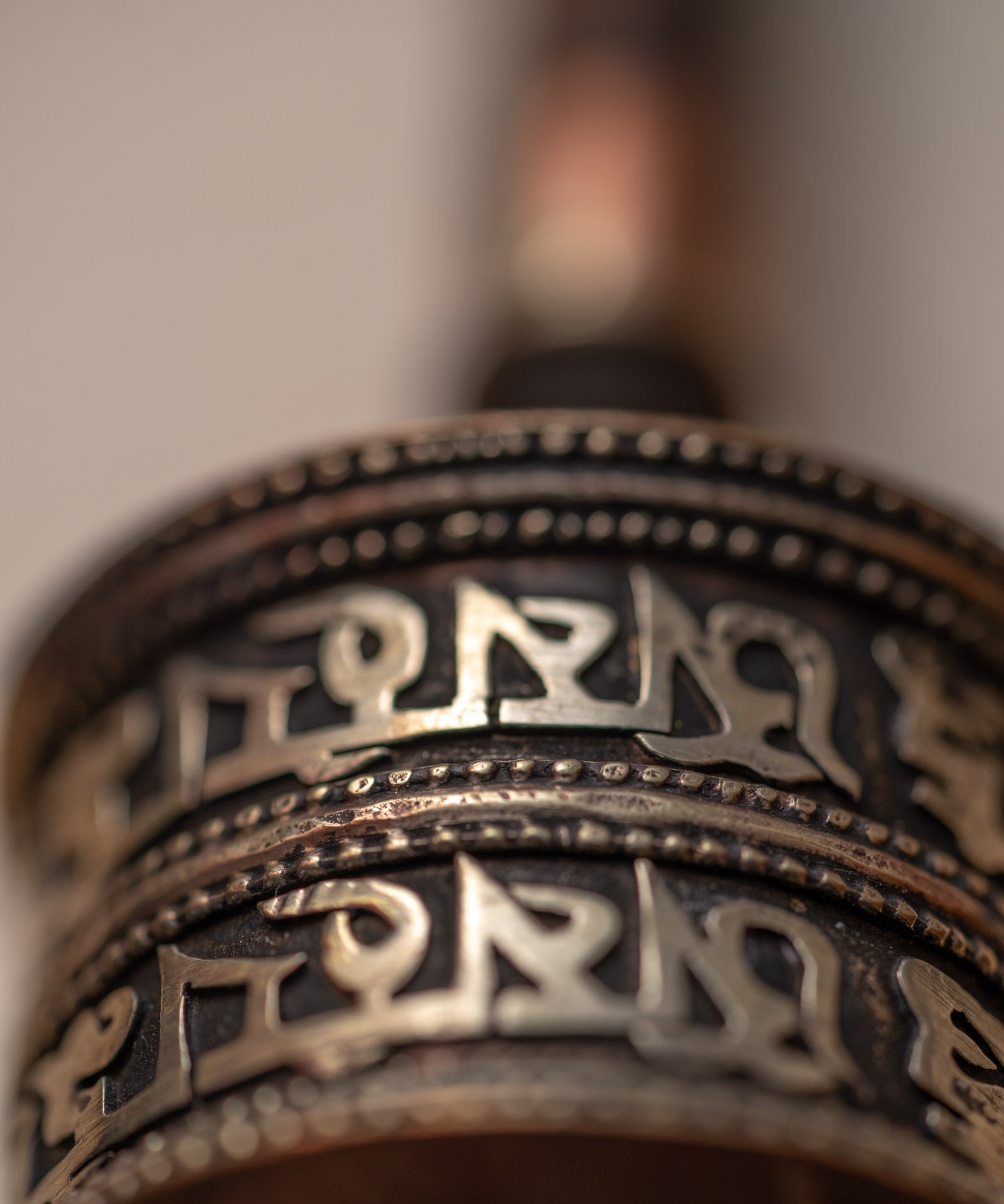 Wood handle prayer wheel for spiritual and religious routines.