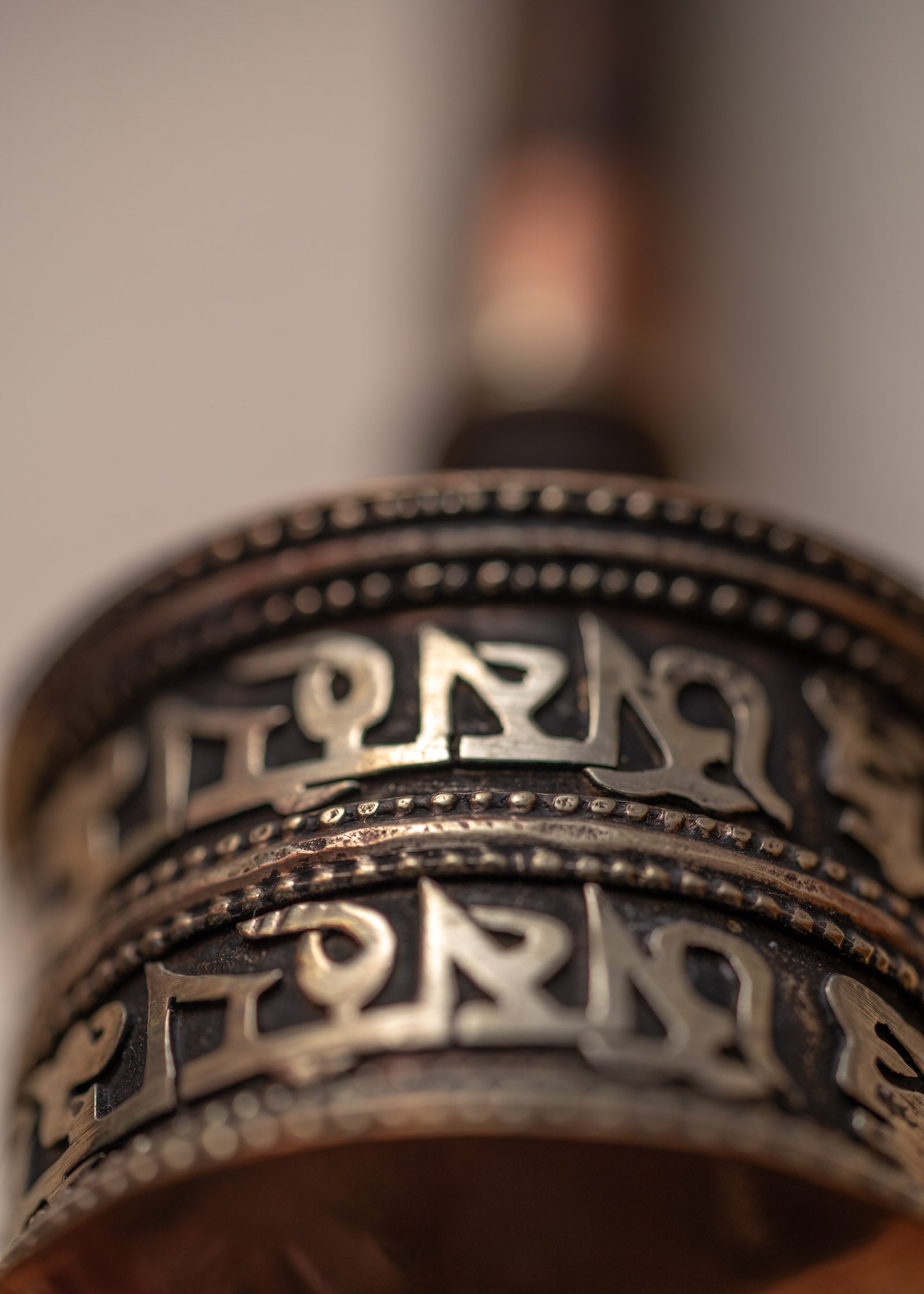 Wood handle prayer wheel for spiritual and religious routines.