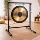 Gong on a stand in a room with wooden floor and decor