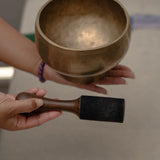 Antique Naga singing bowl with pedestal base tuned to D4 and E4 for chakra healing and meditation