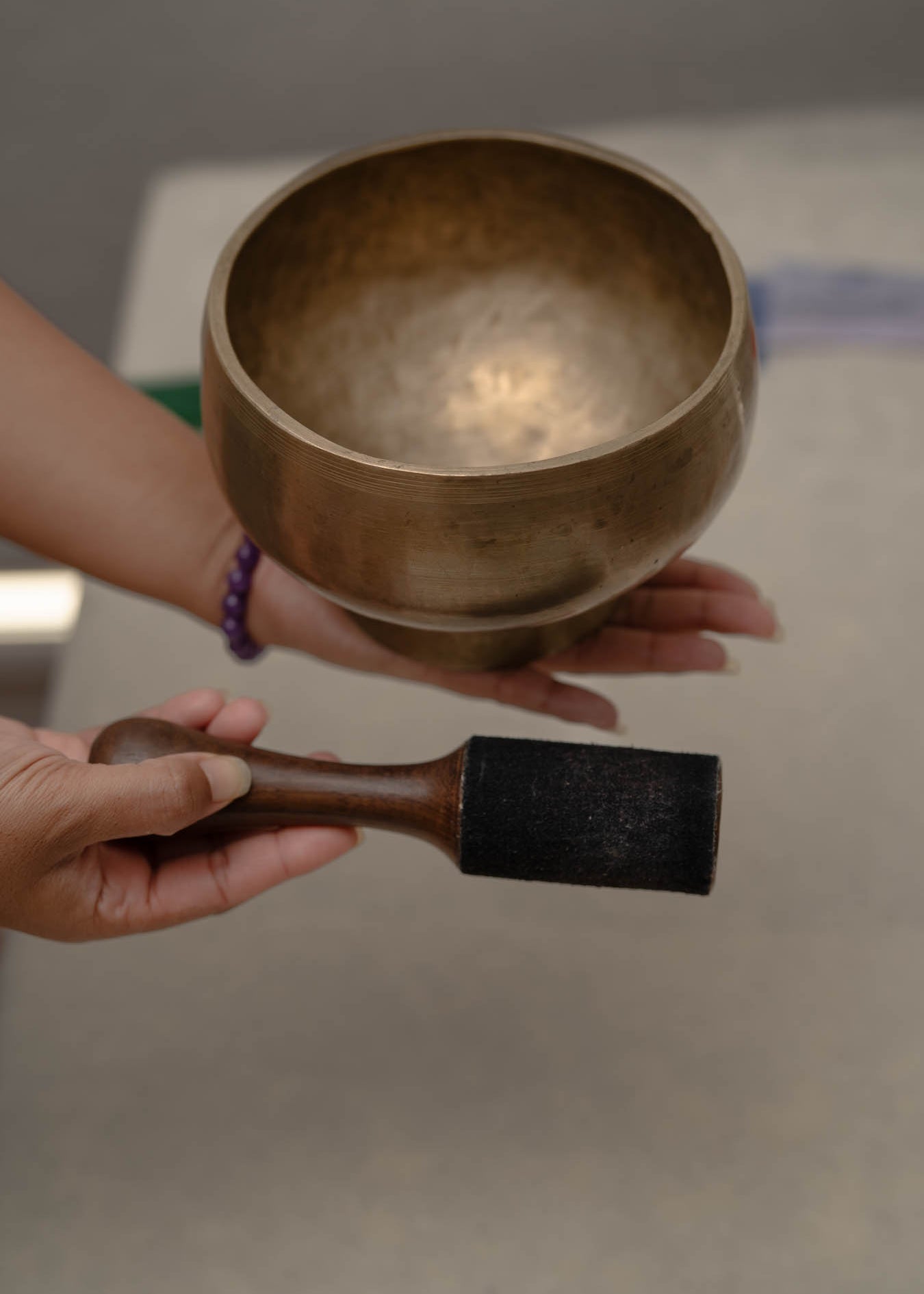 Antique Naga singing bowl with pedestal base tuned to D4 and E4 for chakra healing and meditation