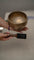Antique Naga singing bowl with pedestal base tuned to D4 and E4 for chakra healing and meditation