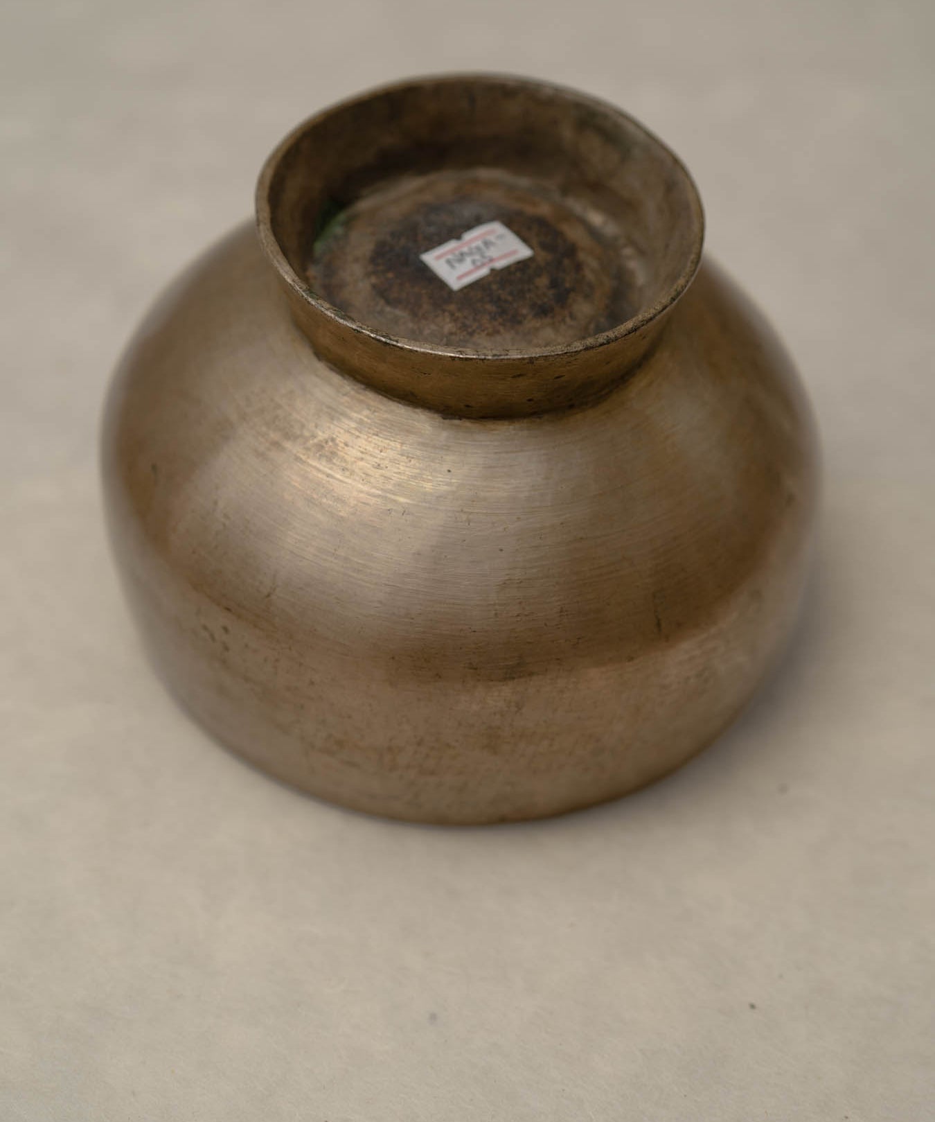 Antique Naga singing bowl with pedestal base tuned to D4 and E4 for chakra healing and meditation