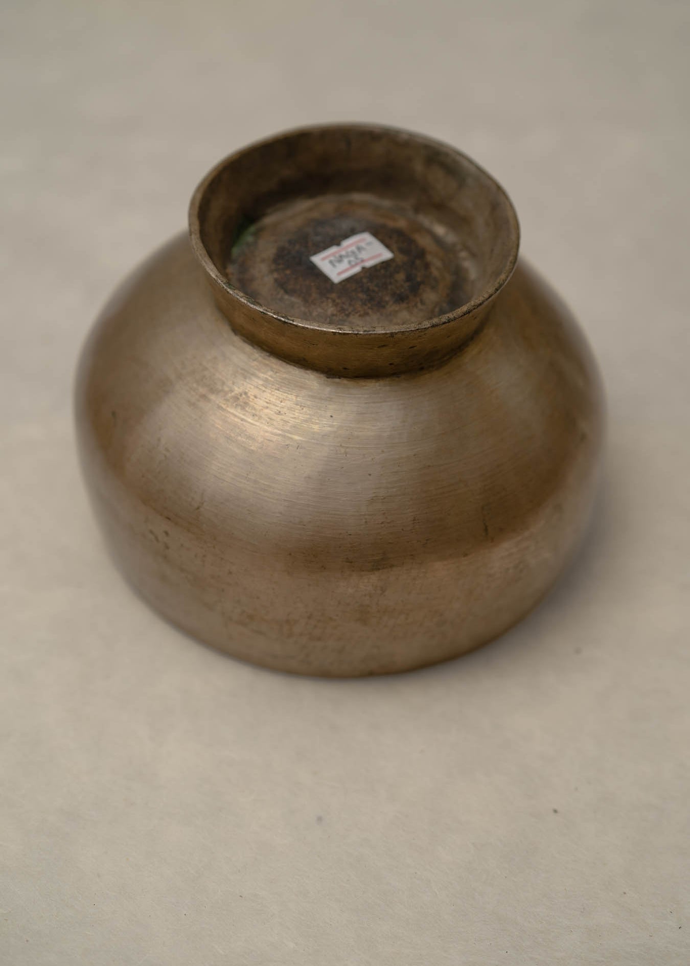 Antique Naga singing bowl with pedestal base tuned to D4 and E4 for chakra healing and meditation