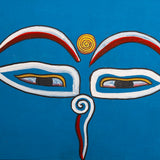 Hand-painted sacred eyes spiral symbols on the forehead and nose, representing wisdom and spiritual awareness.