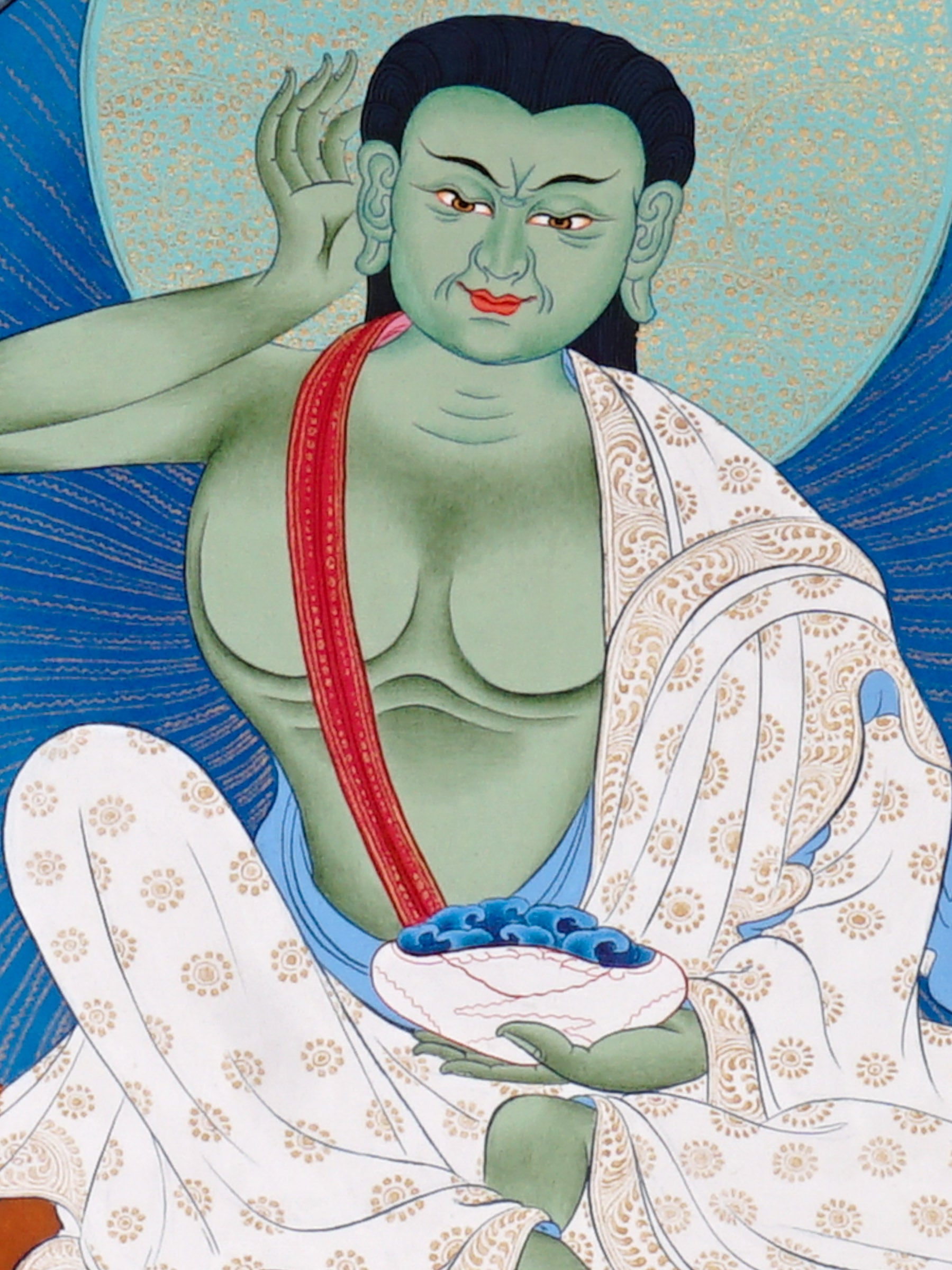 Closure of Milarepa thangka painting showing Tibetan yogi in listening posture.