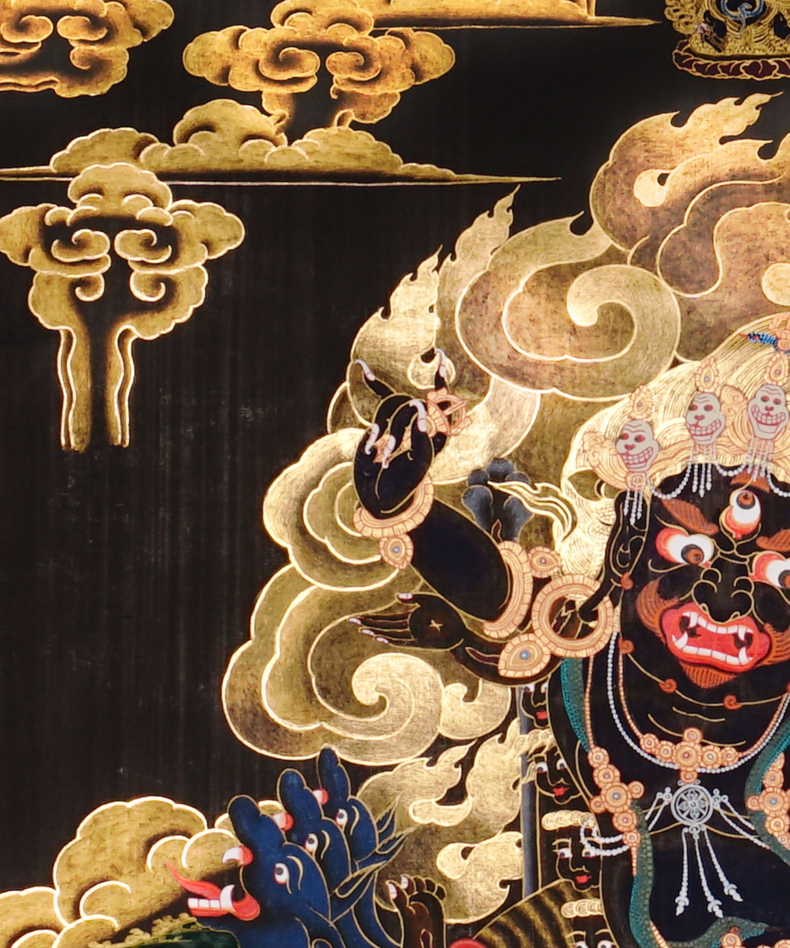 Vajra Guru Thangka Painting showing a wrathful Tibetan Buddhist protector deity riding a fierce blue mount, surrounded by flame aura, golden clouds, skull crown, sacred ornaments, lotus base and offering details.