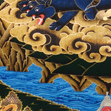 Vajra Guru Thangka Painting showing a wrathful Tibetan Buddhist protector deity riding a fierce blue mount, surrounded by flame aura, golden clouds, skull crown, sacred ornaments, lotus base and offering details.