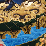 Vajra Guru Thangka Painting showing a wrathful Tibetan Buddhist protector deity riding a fierce blue mount, surrounded by flame aura, golden clouds, skull crown, sacred ornaments, lotus base and offering details.