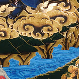 Vajra Guru Thangka Painting showing a wrathful Tibetan Buddhist protector deity riding a fierce blue mount, surrounded by flame aura, golden clouds, skull crown, sacred ornaments, lotus base and offering details.