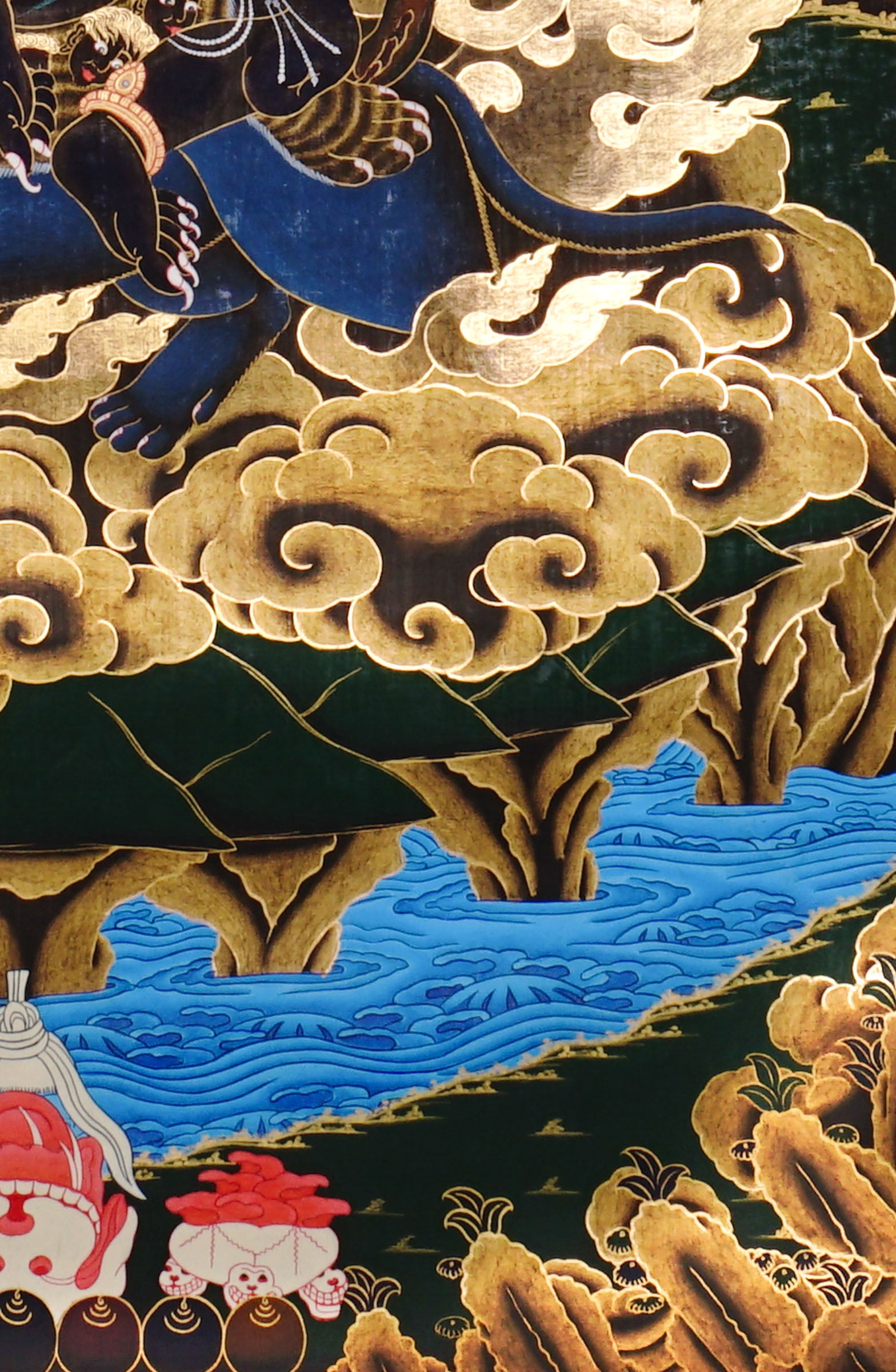 Vajra Guru Thangka Painting showing a wrathful Tibetan Buddhist protector deity riding a fierce blue mount, surrounded by flame aura, golden clouds, skull crown, sacred ornaments, lotus base and offering details.