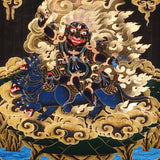 Vajra Guru Thangka Painting showing a wrathful Tibetan Buddhist protector deity riding a fierce blue mount, surrounded by flame aura, golden clouds, skull crown, sacred ornaments, lotus base and offering details.