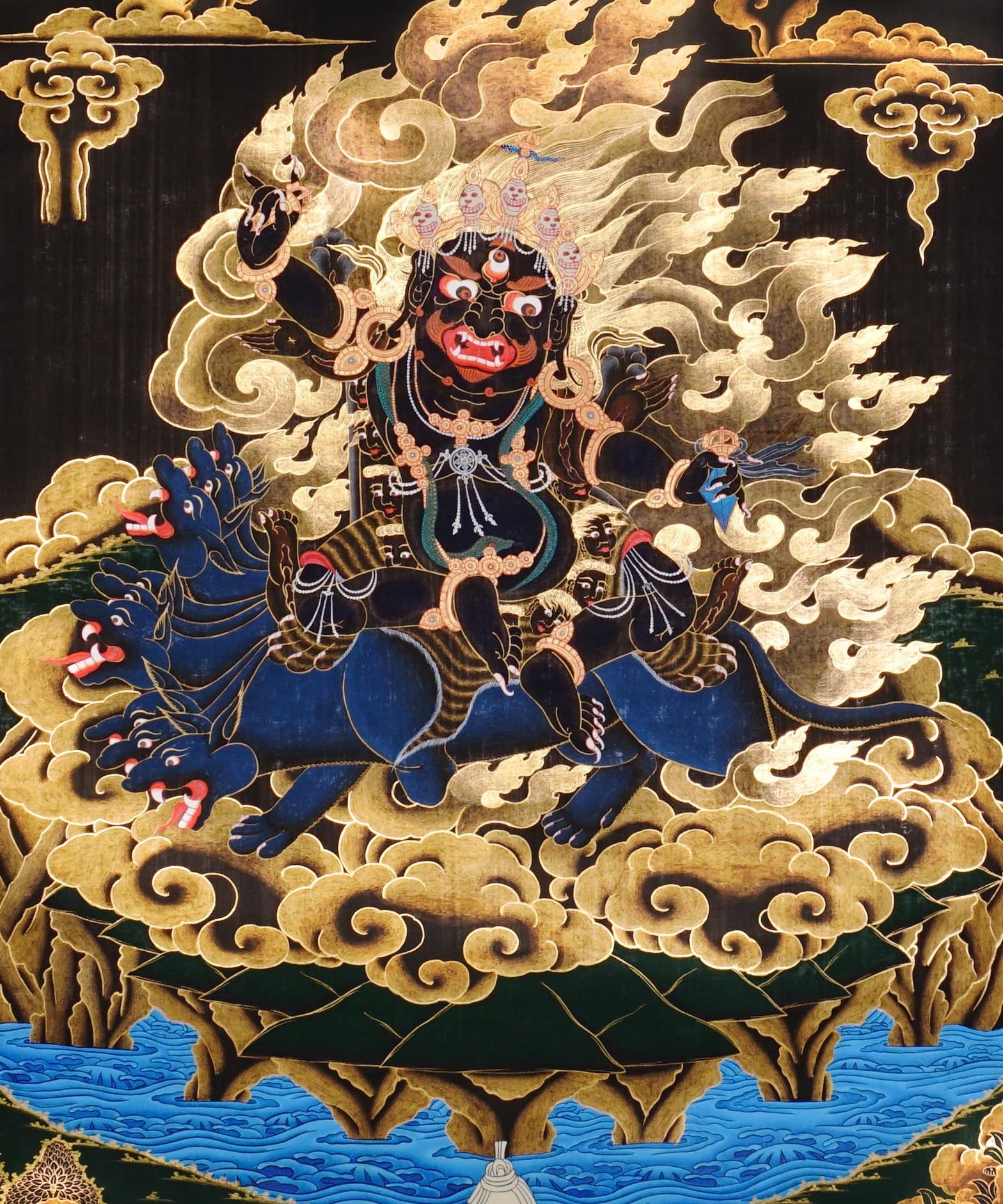 Vajra Guru Thangka Painting showing a wrathful Tibetan Buddhist protector deity riding a fierce blue mount, surrounded by flame aura, golden clouds, skull crown, sacred ornaments, lotus base and offering details.